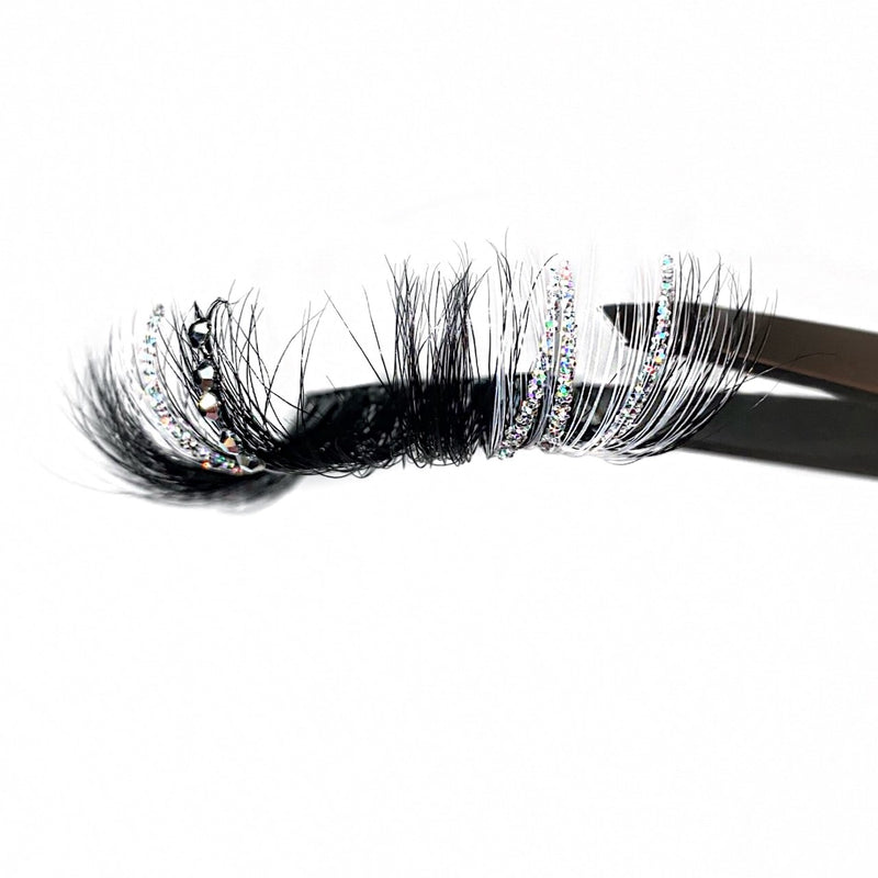 Two-Toned White Strip Eyelash Extensions With A Bling Lash Made Of Silver Rhinestones. An Amazing Eyelash With Silver Glitter Lashes And Long White Color Lashes. Lash Out In Trendy Colored Eyelashes.