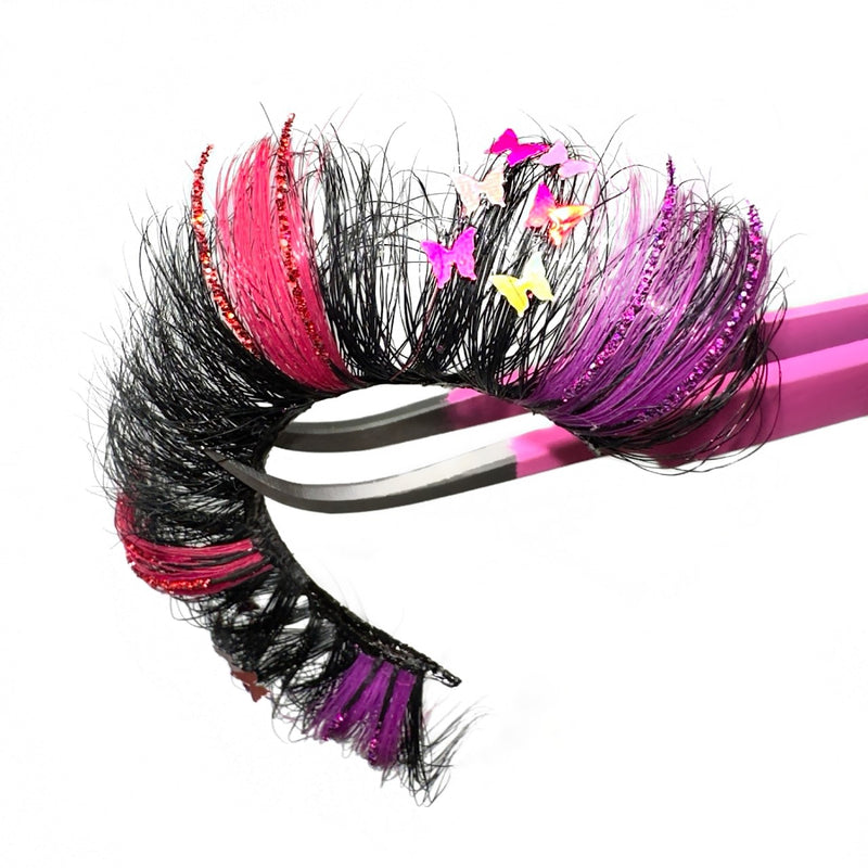 3D Luxury Mink Decal Glitter Color Lashes. Hot Pink And Purple 2 Different Colored Eyelashes. Glitter Color Lashes With Holographic Butterfly Decals. Lash Artistry Purple Pink Eyelash Extensions. Fluffy Mega Volume 25mm Strip Colored Lashes For Lash Lovers.