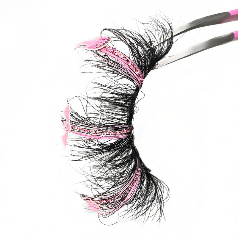 3D Mink Halloween Lash Extensions. Color Lashes With Pink Glitter. Three Tone Pink Lashes With Pink Spider, Bat, And Pumpkin Lash Decals. Eyelashes With Fluffy Wispy Volume. Eyelashes For Halloween Looks.